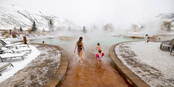 Family walking into Yellowstone Hot Spring